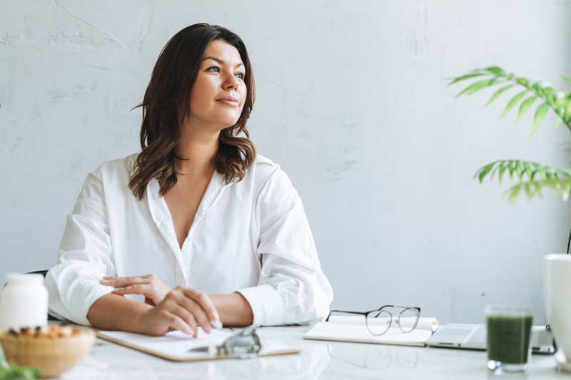 young woman nutritionist plus size in white shirt