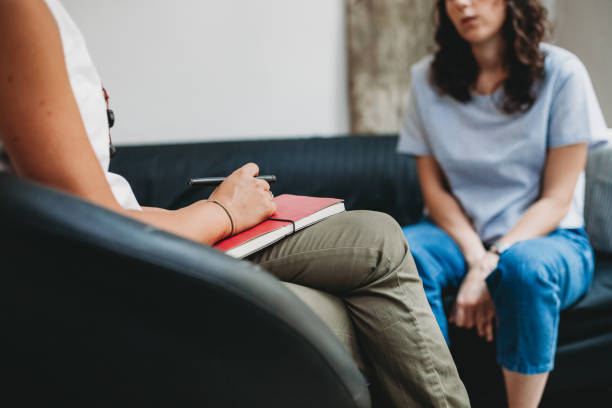 Woman with anxiety speaking with a doctor